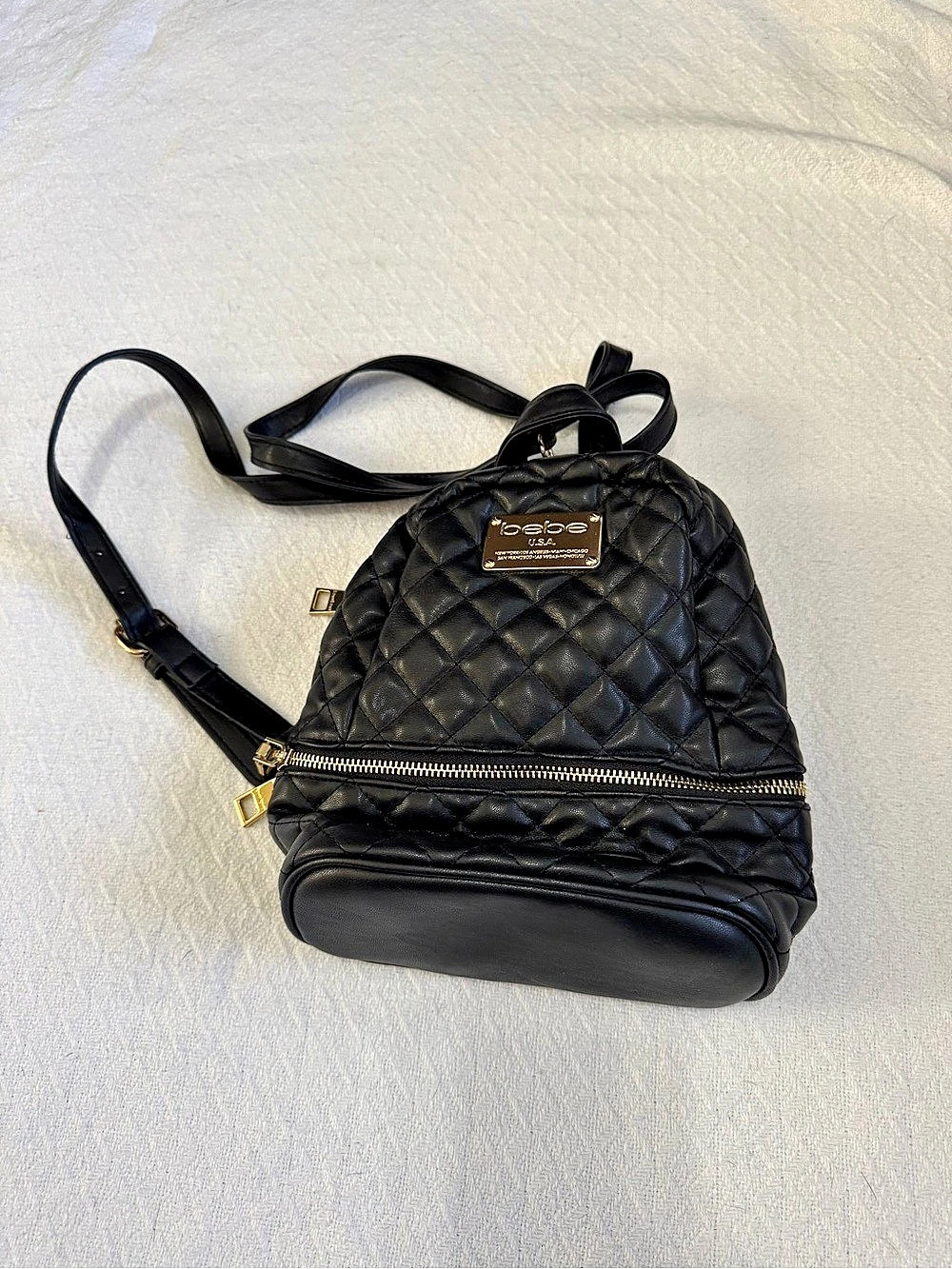 bebe Quilted Black Backpack with Gold Plaque Mini Backpack with Gold Plaque